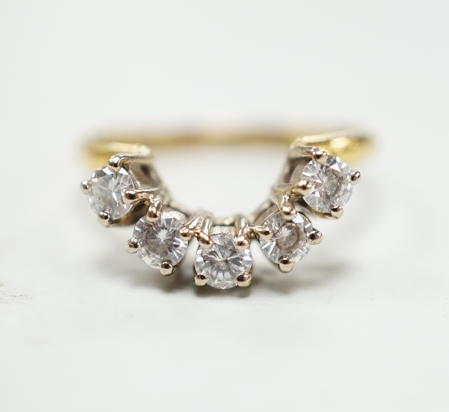 A modern 18ct gold and five stone diamond set demi-lune ring (part of a wedding set?) size M, gross 2.9 grams.